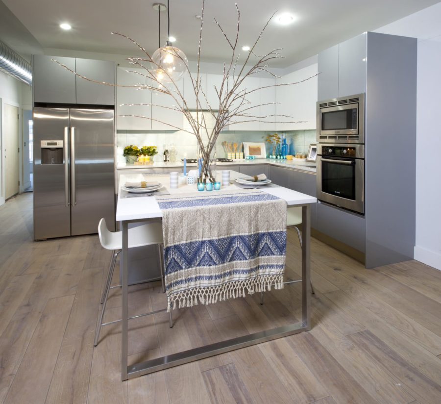 Frameless white upper cabinets paired with frameless light gray base cabinets