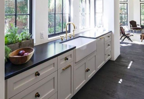 galley kitchen features bronze hardware and white cabinets