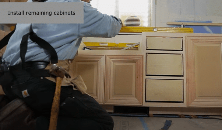Install remaining base cabinets.