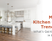 Bright modern kitchen featuring white cabinets, island seating, and warm wood flooring